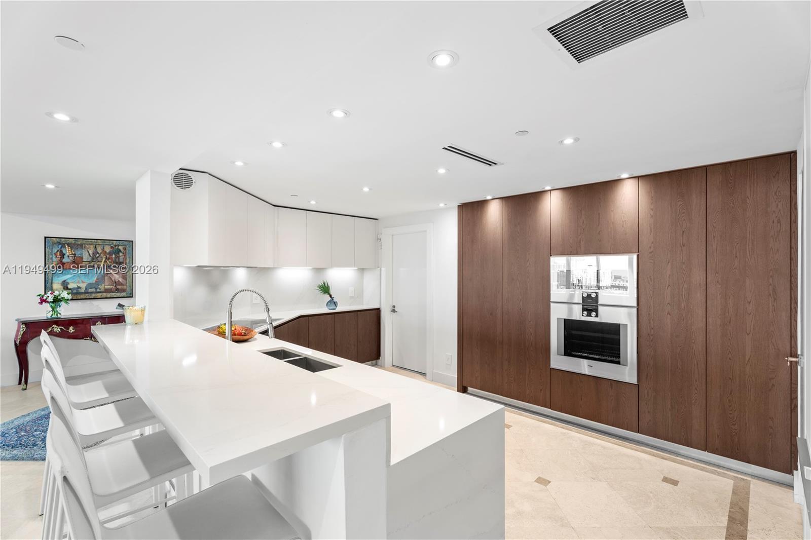 1643 Brickell Avenue, Unit 2506 Miami, FL 33129 - Photo 7 of 85 a large white kitchen with a large window