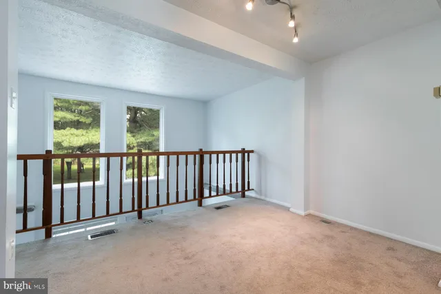 an empty room with windows