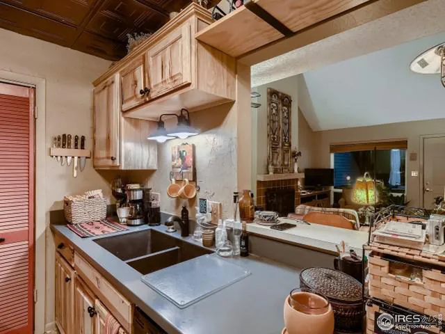 a kitchen with a stove a sink and a refrigerator