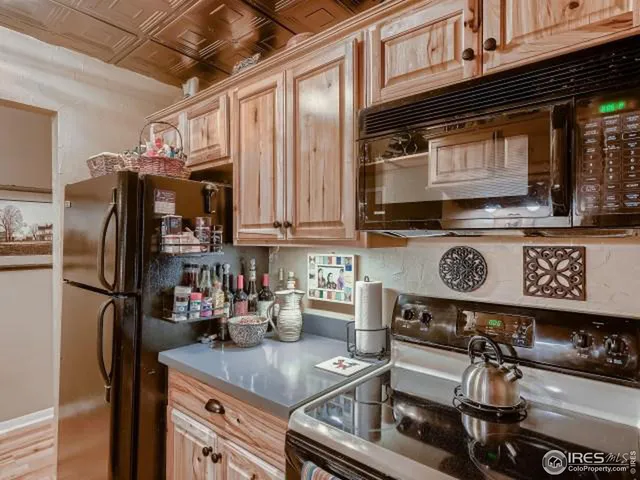 a kitchen with stainless steel appliances granite countertop a stove and a refrigerator