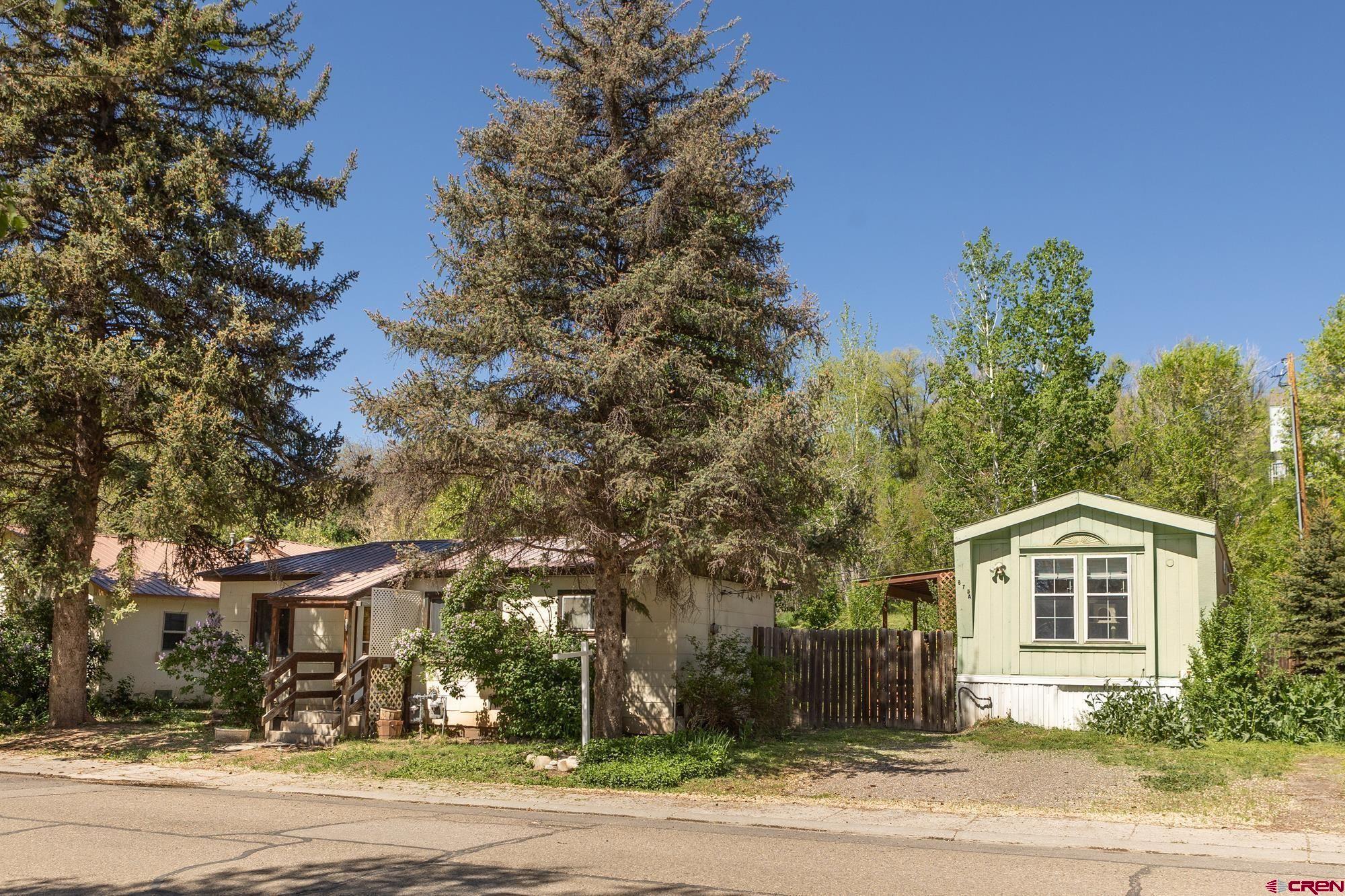 875 Browning Avenue Ignacio, CO 81137 - Photo 12 of 24 a front view of a house with a yard