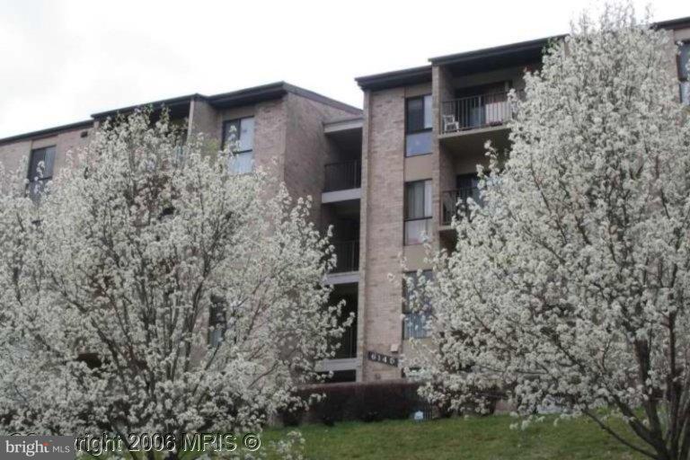 a brick building with a yard