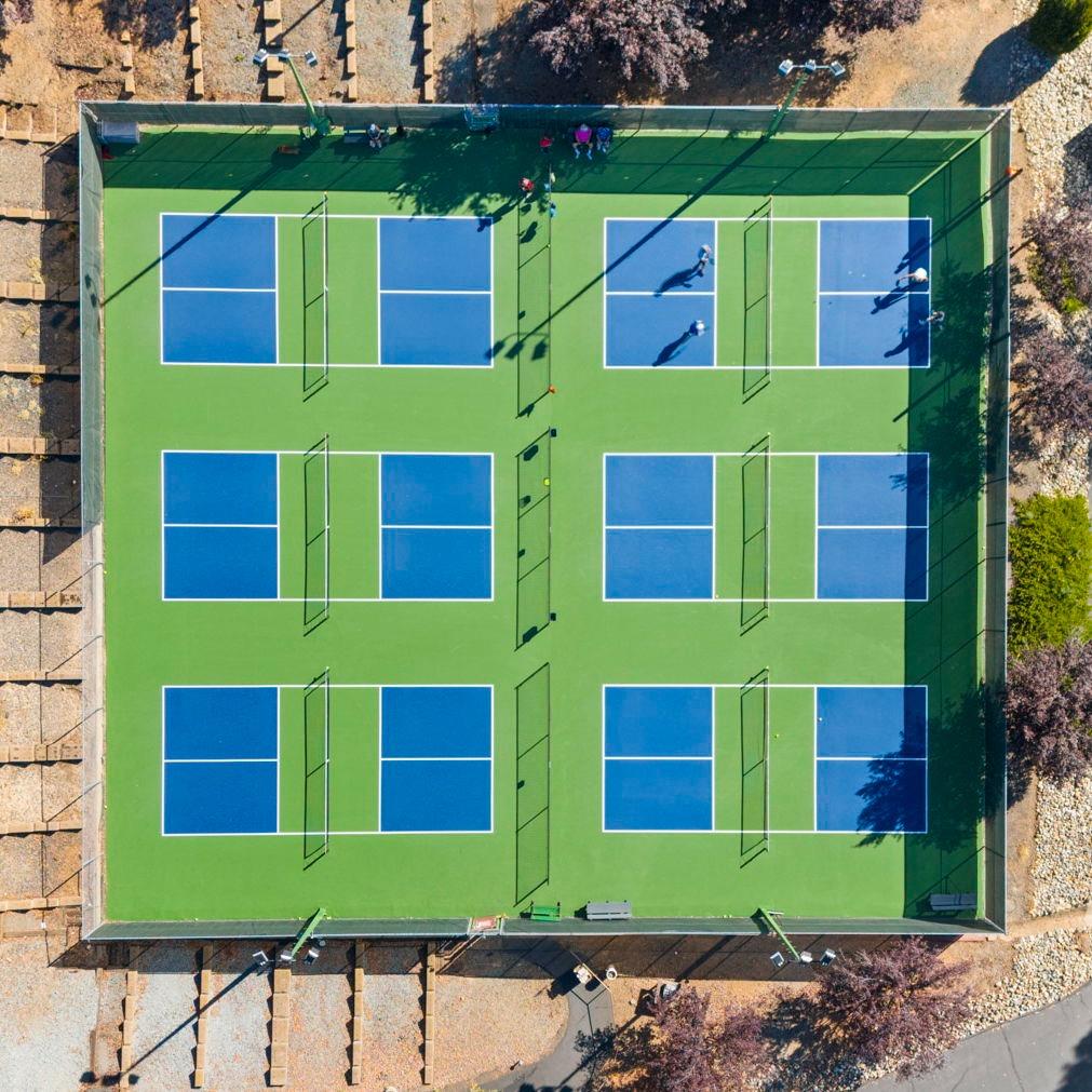 308 Longview Street Groveland, CA 95321 - Photo 12 of 16 a front view of a brick building with a yard and a garage