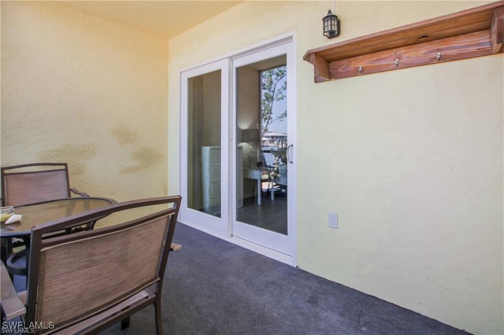 3226 Stringfellow Road St. James City, FL 33956 - Photo 14 of 28 a view of room with hallway