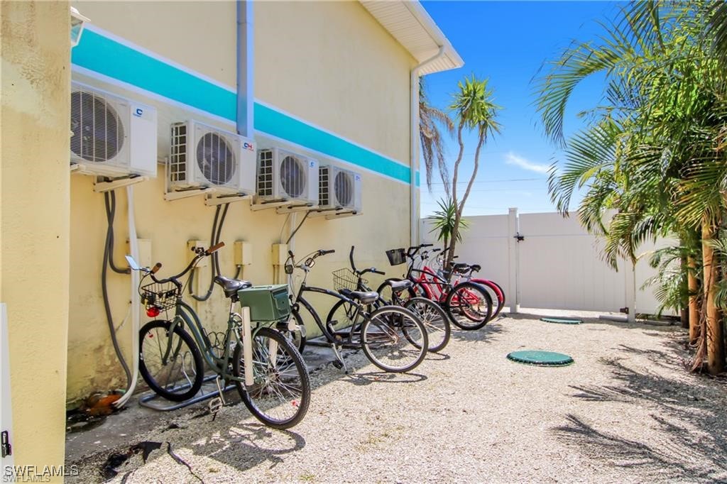 3226 Stringfellow Road St. James City, FL 33956 - Photo 16 of 28 a view of bike storage next to a blue wall