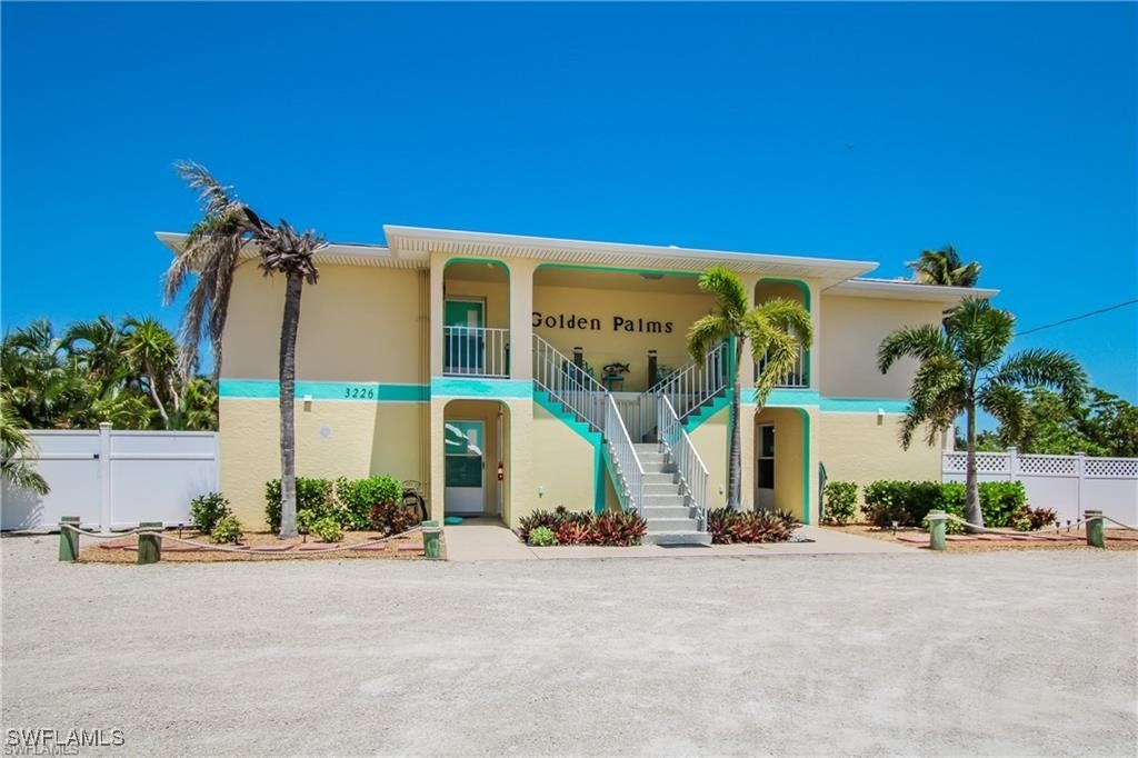 3226 Stringfellow Road St. James City, FL 33956 - Photo 5 of 28 a view of a building with a street