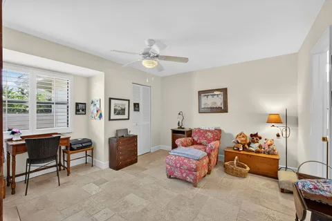 a bedroom with furniture and a window