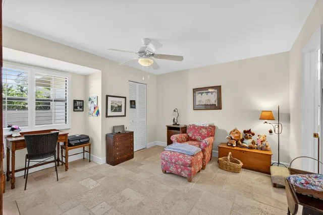 a bedroom with furniture and a window