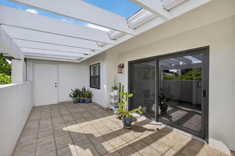 a view of a porch with seating space