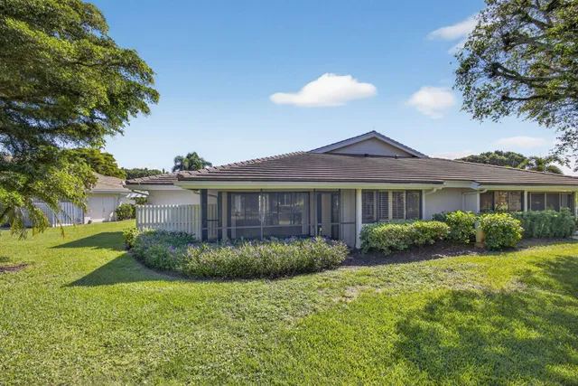 a view of a big yard in front of a house