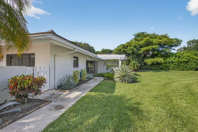 a house view with a garden space