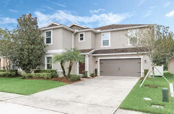 front view of a house with a yard