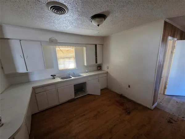 a bathroom with a tub toilet sink and mirror