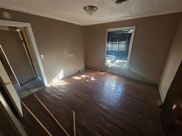 a kitchen with stainless steel appliances granite countertop a sink and cabinets with wooden floor