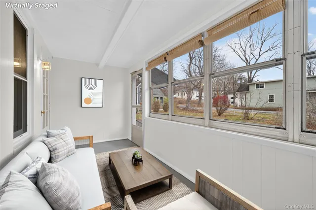 a living room with furniture and a window