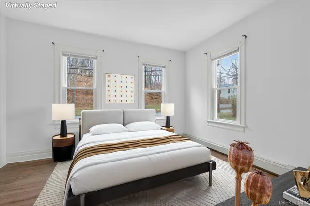 a bedroom with bed and a window