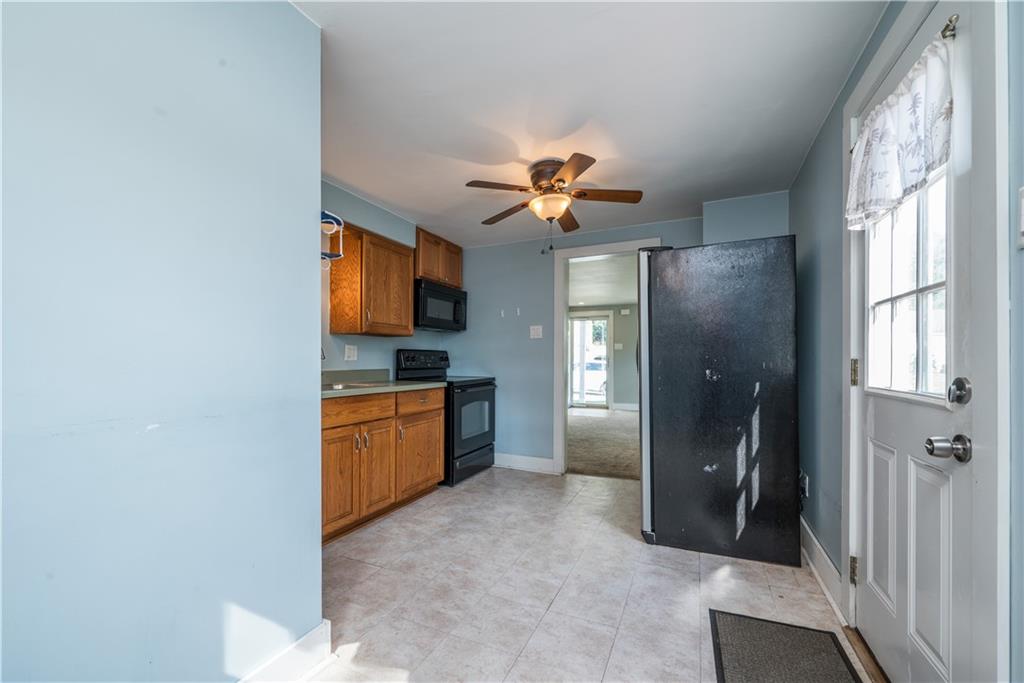2138 Swallow Hill Road Pittsburgh, PA 15220 - Photo 13 of 29 a kitchen with stainless steel appliances granite countertop a refrigerator and a sink