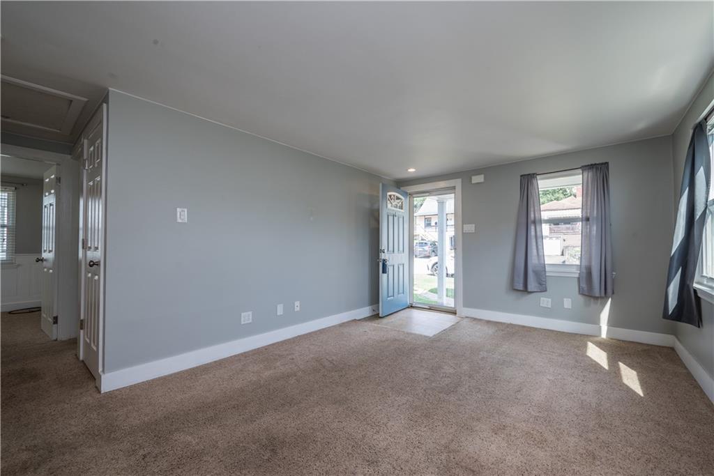 2138 Swallow Hill Road Pittsburgh, PA 15220 - Photo 6 of 29 a view of a big room with windows and chandelier fan