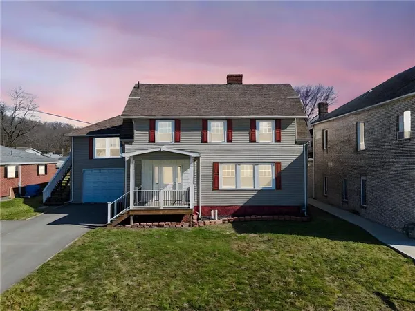 front view of a house with a yard