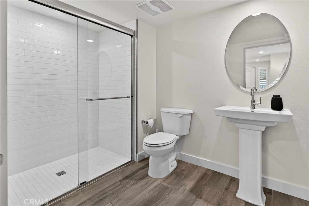 3446 Doheny Way Dana Point, CA 92629 - Photo 18 of 58 a bathroom with a toilet a sink and a mirror