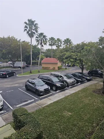 a view of a backyard with sitting area