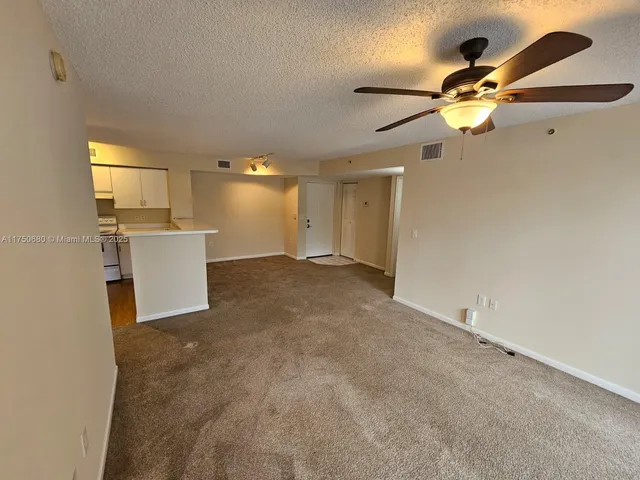 a view of a kitchen with a sink