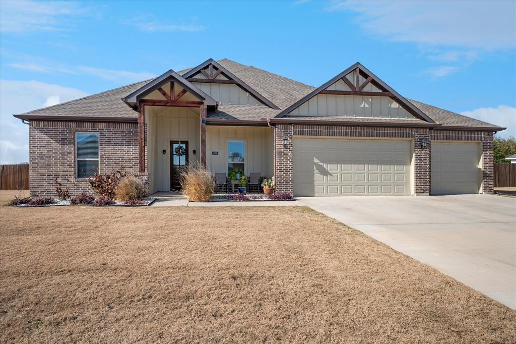 Beautifully landscsaped front yard. 3 Car Garage with pull through to backyard. Storm Shelter located in garage.