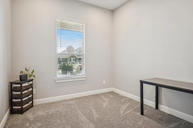 a bathroom with a granite countertop sink toilet and a mirror