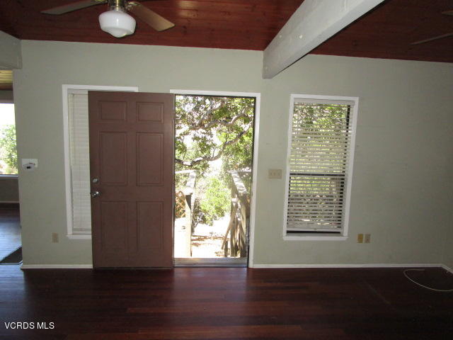 1019 Alta Vista Road Simi Valley, CA 93063 - Photo 14 of 22 an empty room with wooden floor and windows