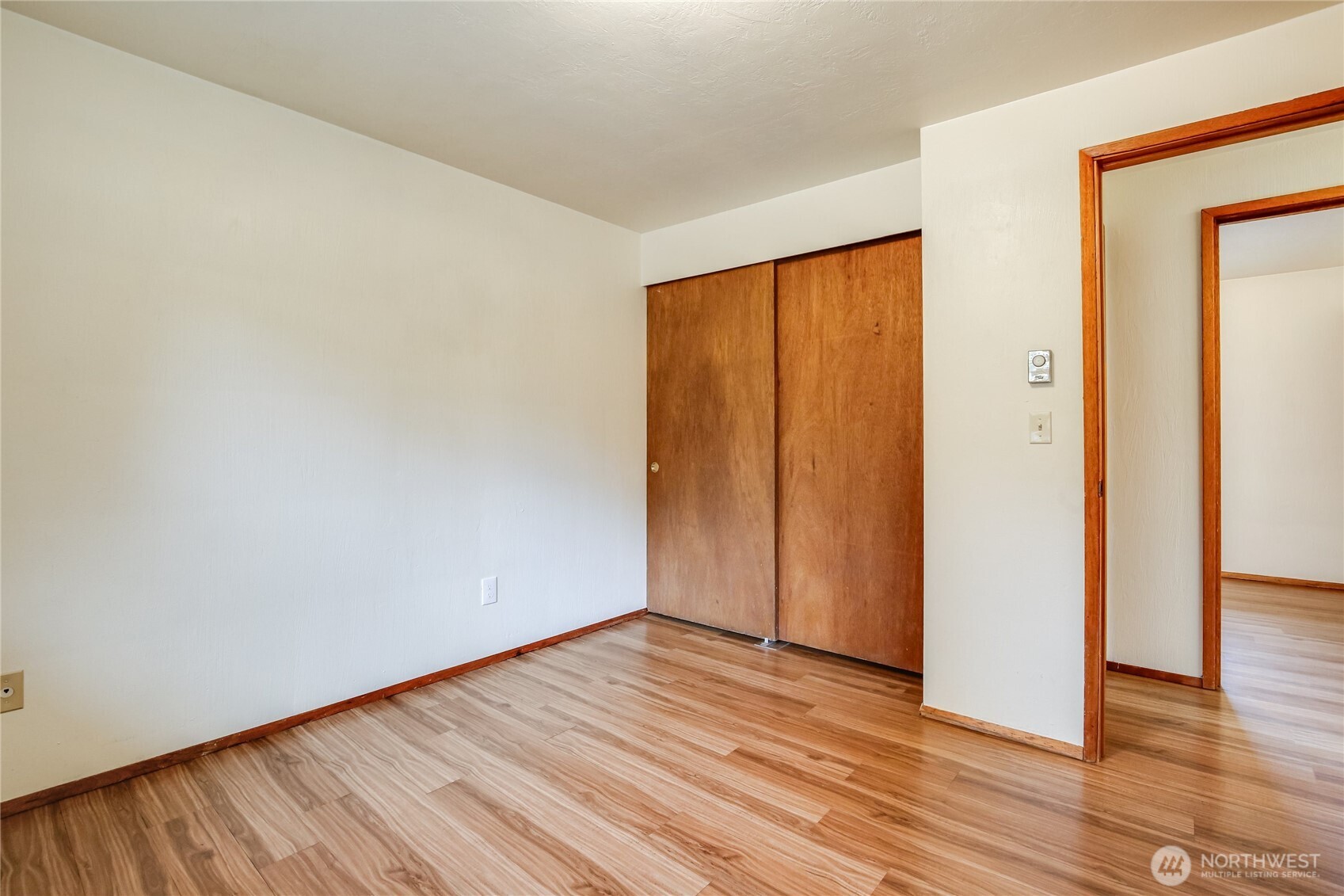 1901 Northeast 30th Street Bremerton, WA 98310 - Photo 11 of 31 an empty room with wooden floor and closet