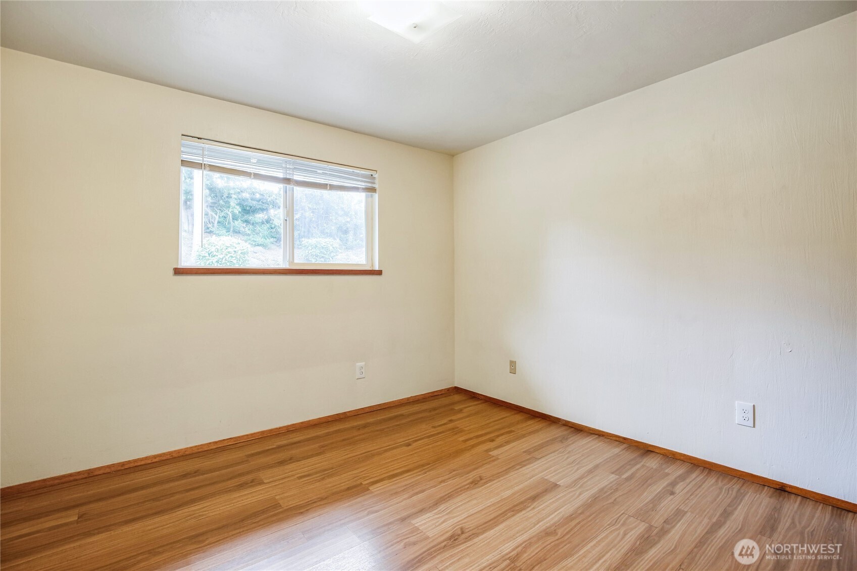 1901 Northeast 30th Street Bremerton, WA 98310 - Photo 12 of 31 an empty room with wooden floor and windows