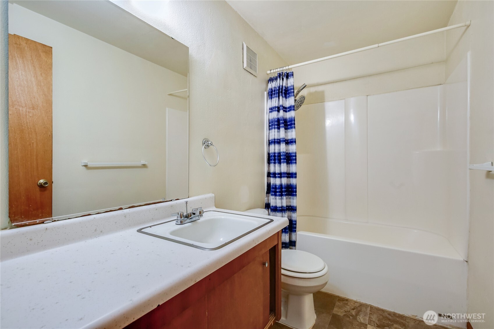 1901 Northeast 30th Street Bremerton, WA 98310 - Photo 13 of 31 a bathroom with a sink a toilet and shower