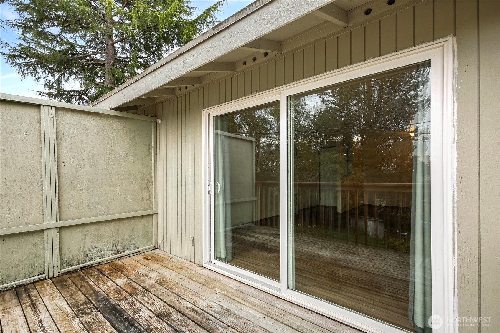 1901 Northeast 30th Street Bremerton, WA 98310 - Photo 14 of 31 a view of a glass door with a backyard from a window