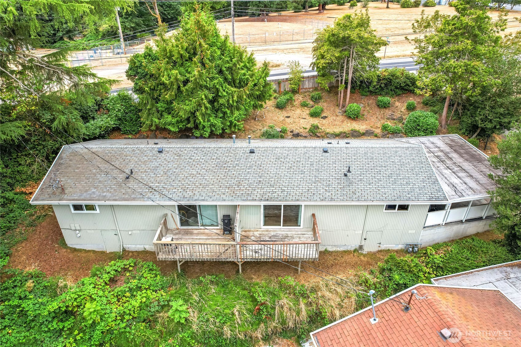 1901 Northeast 30th Street Bremerton, WA 98310 - Photo 20 of 31 a aerial view of a house with a yard table and chairs