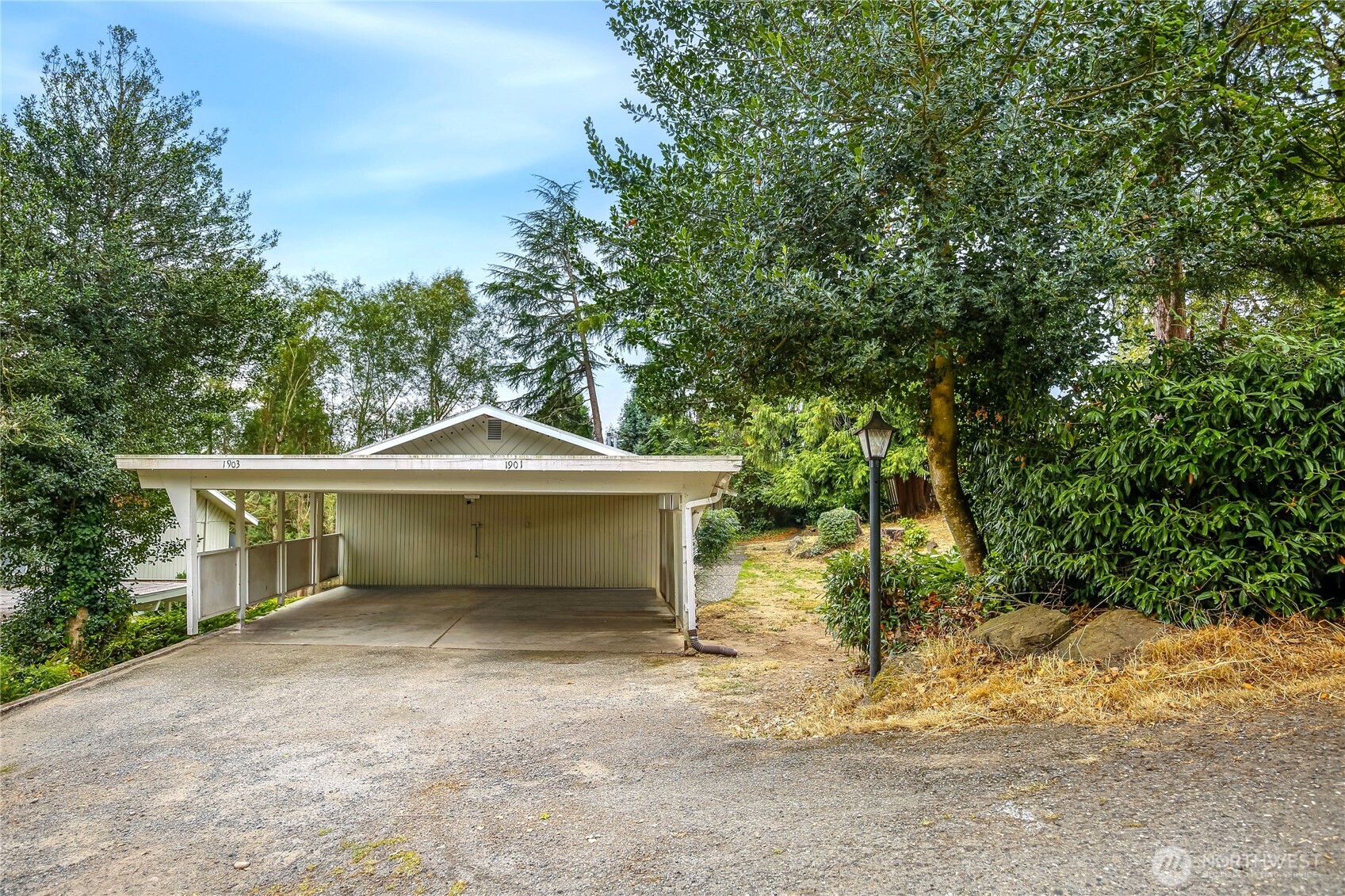1901 Northeast 30th Street Bremerton, WA 98310 - Photo 2 of 31 a front view of a house with a yard and garage