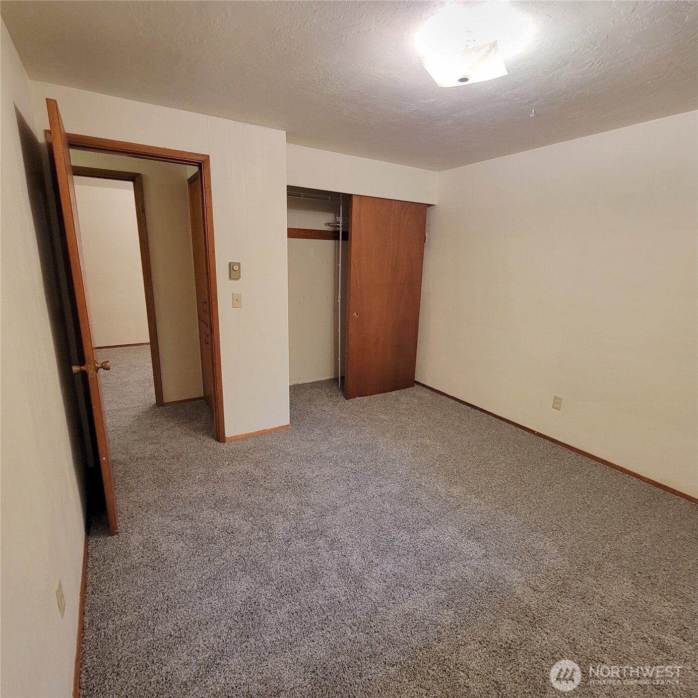 1901 Northeast 30th Street Bremerton, WA 98310 - Photo 26 of 31 an empty room with closet and mirror