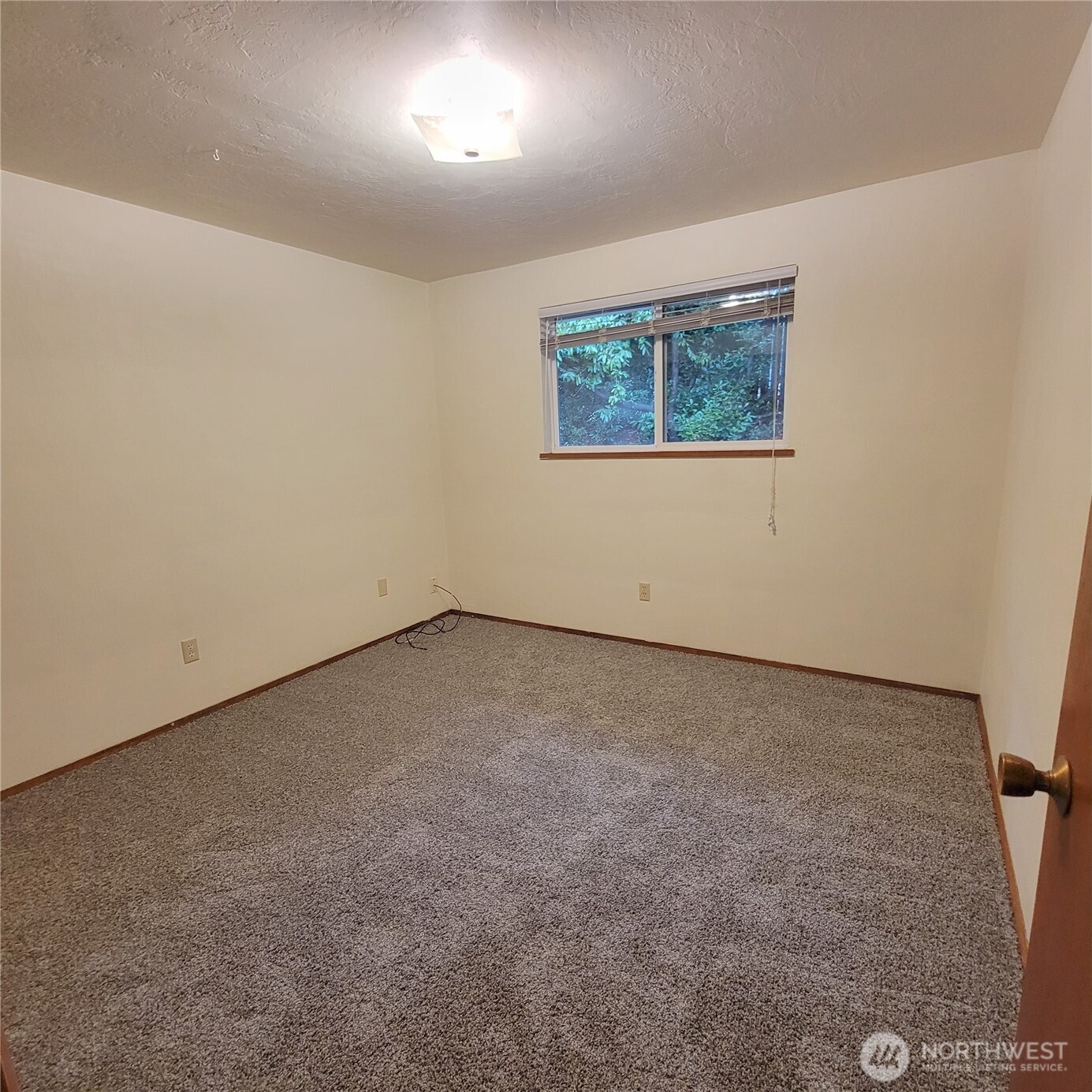 1901 Northeast 30th Street Bremerton, WA 98310 - Photo 27 of 31 an empty room with a empty space and window