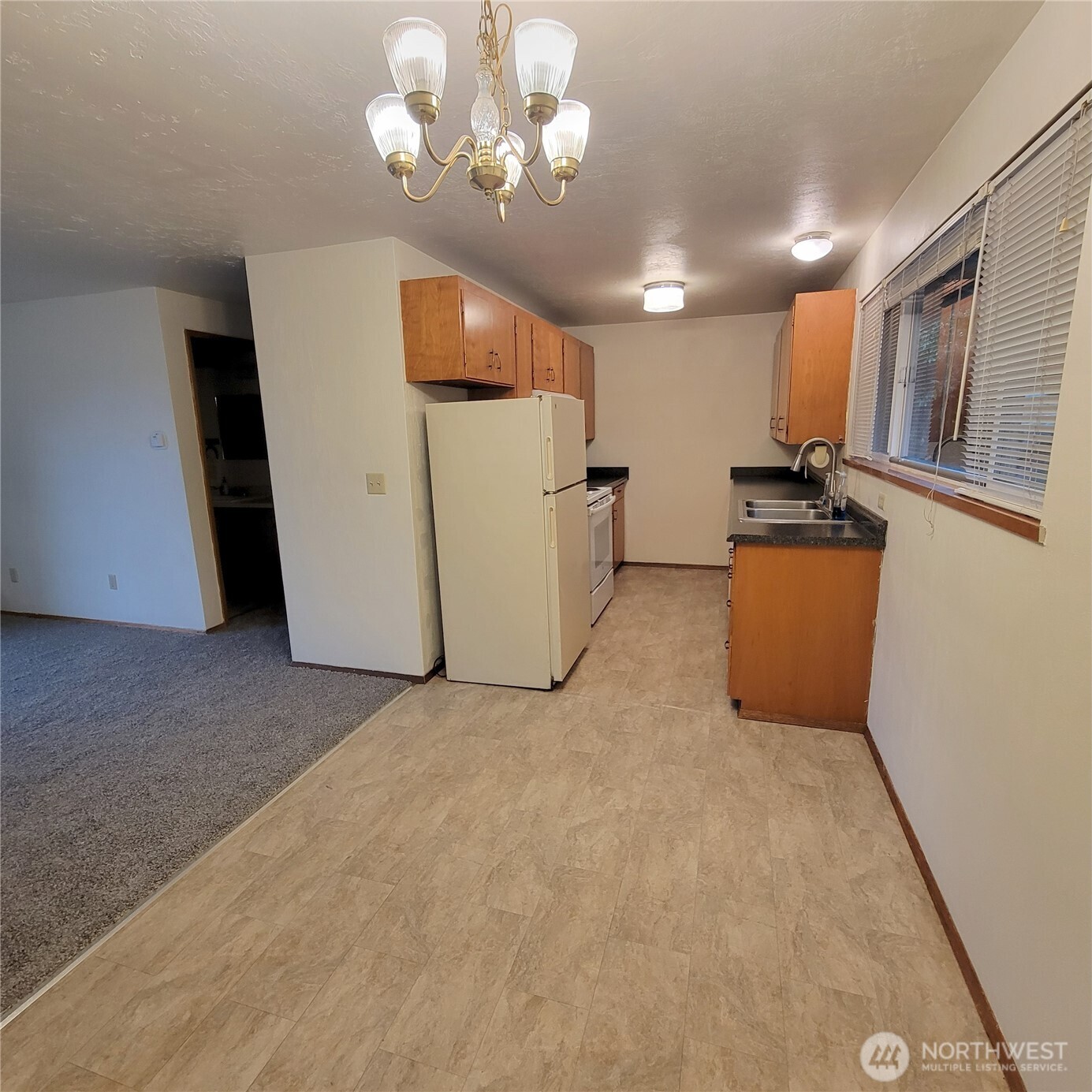 1901 Northeast 30th Street Bremerton, WA 98310 - Photo 30 of 31 a view of a livingroom with furniture and a chandelier