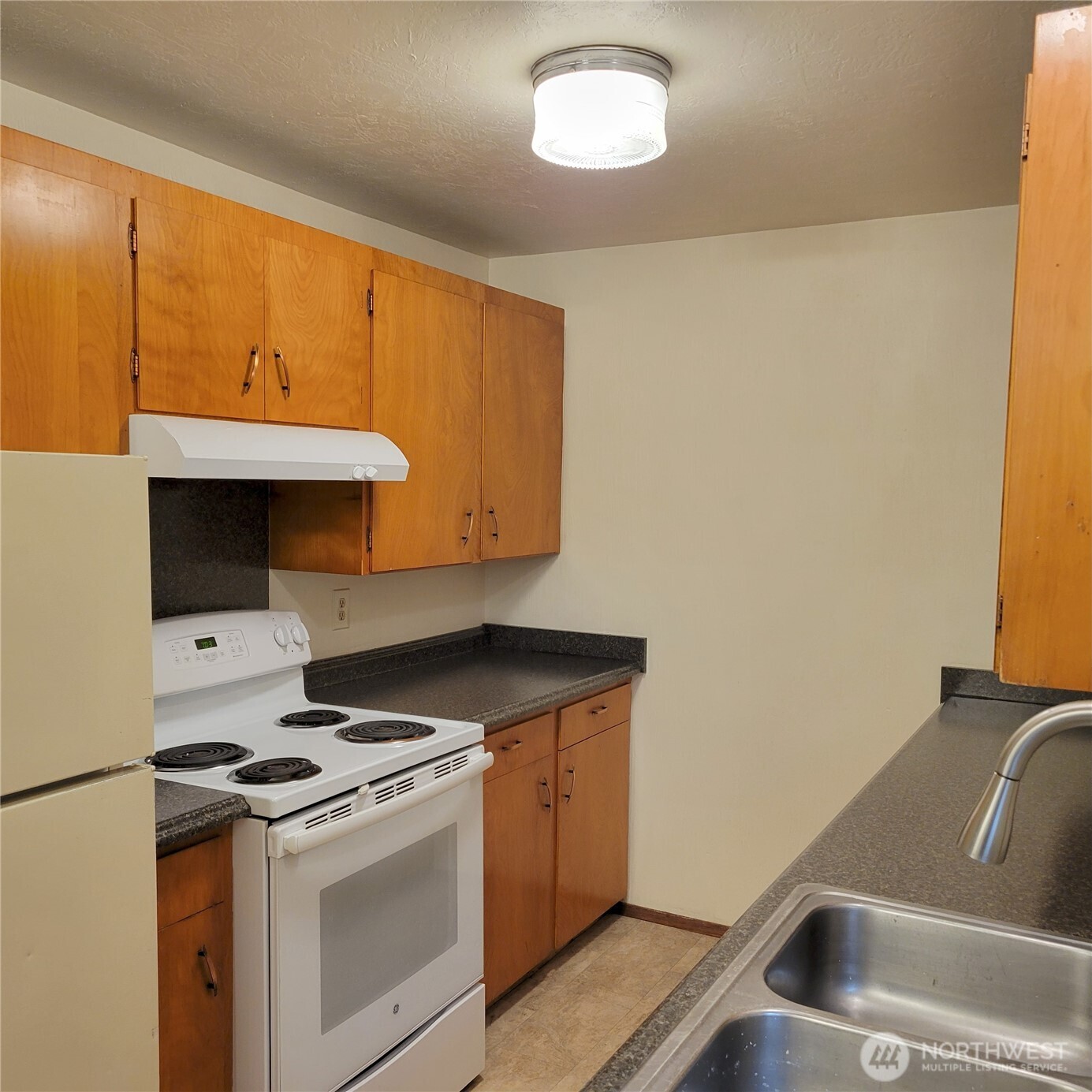 1901 Northeast 30th Street Bremerton, WA 98310 - Photo 31 of 31 a kitchen with a stove and a sink