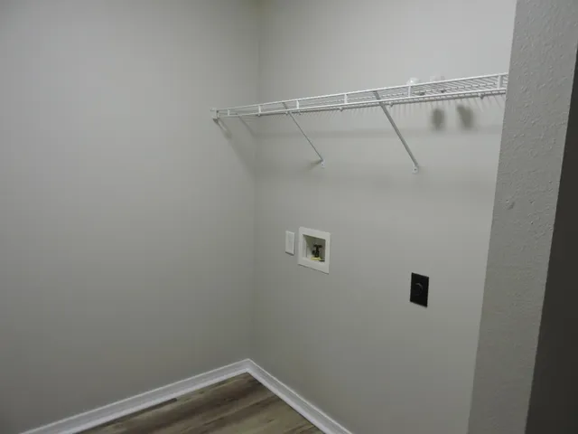 a view of a room with racks on the wall