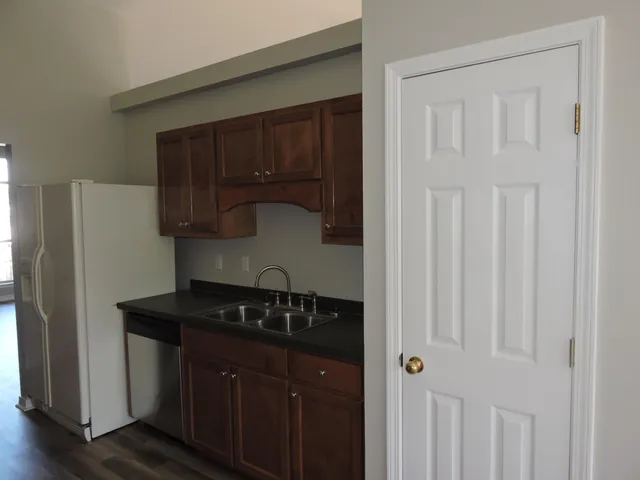 a kitchen with a sink and cabinets