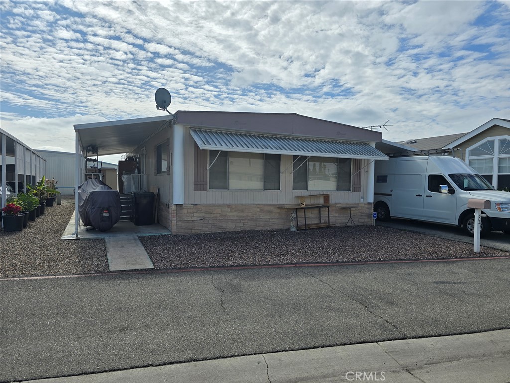 22 Magnolia Via Anaheim, CA 92801 - Photo 1 of 30 a view of a house with a garage