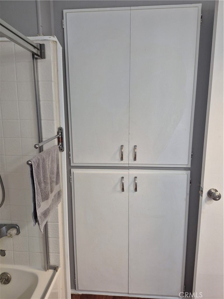 22 Magnolia Via Anaheim, CA 92801 - Photo 14 of 30 a bathroom with a shower and a sink