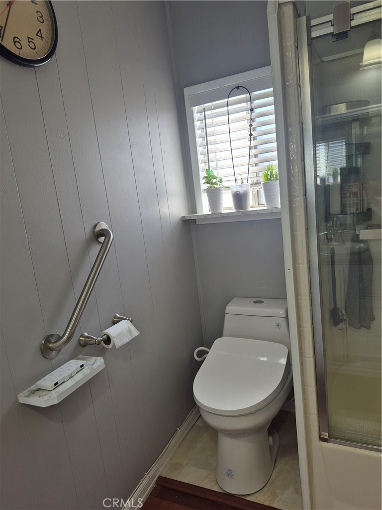 22 Magnolia Via Anaheim, CA 92801 - Photo 16 of 30 a bathroom with a toilet and a shower