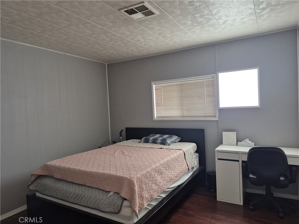 22 Magnolia Via Anaheim, CA 92801 - Photo 18 of 30 a bedroom with a bed and a chair