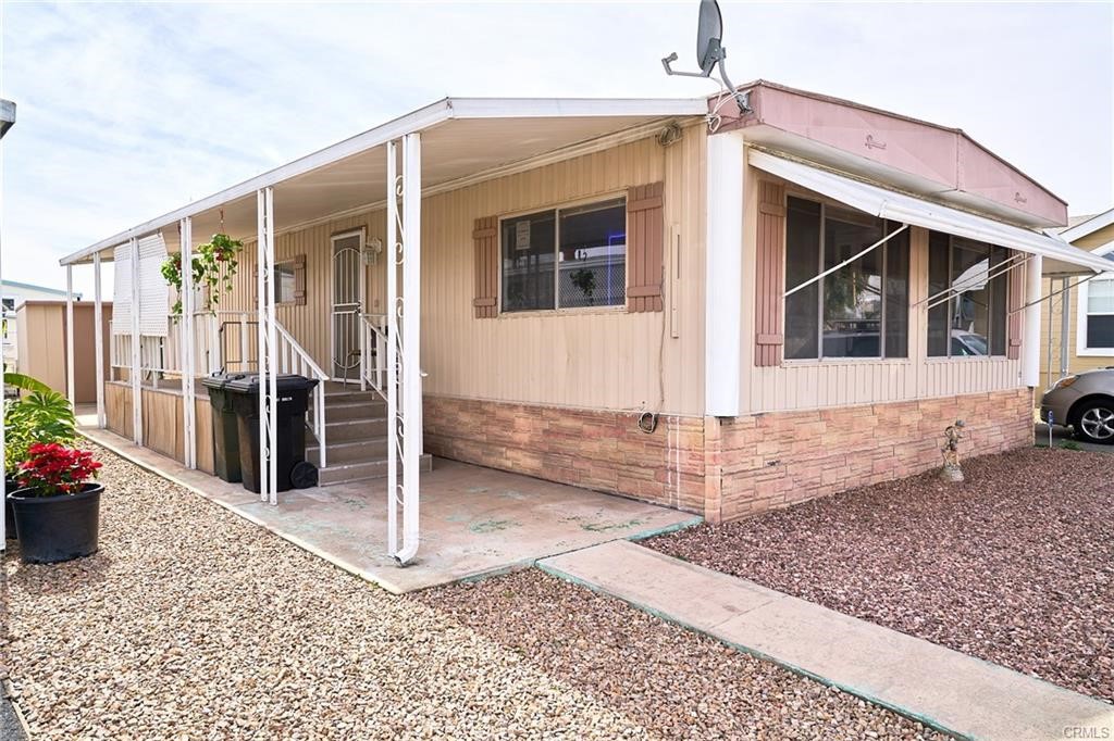 22 Magnolia Via Anaheim, CA 92801 - Photo 2 of 30 a view of a house with wooden fence