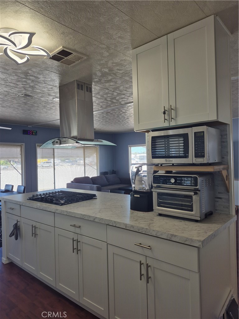 22 Magnolia Via Anaheim, CA 92801 - Photo 24 of 30 a kitchen with stainless steel appliances a sink dishwasher a stove and cabinets