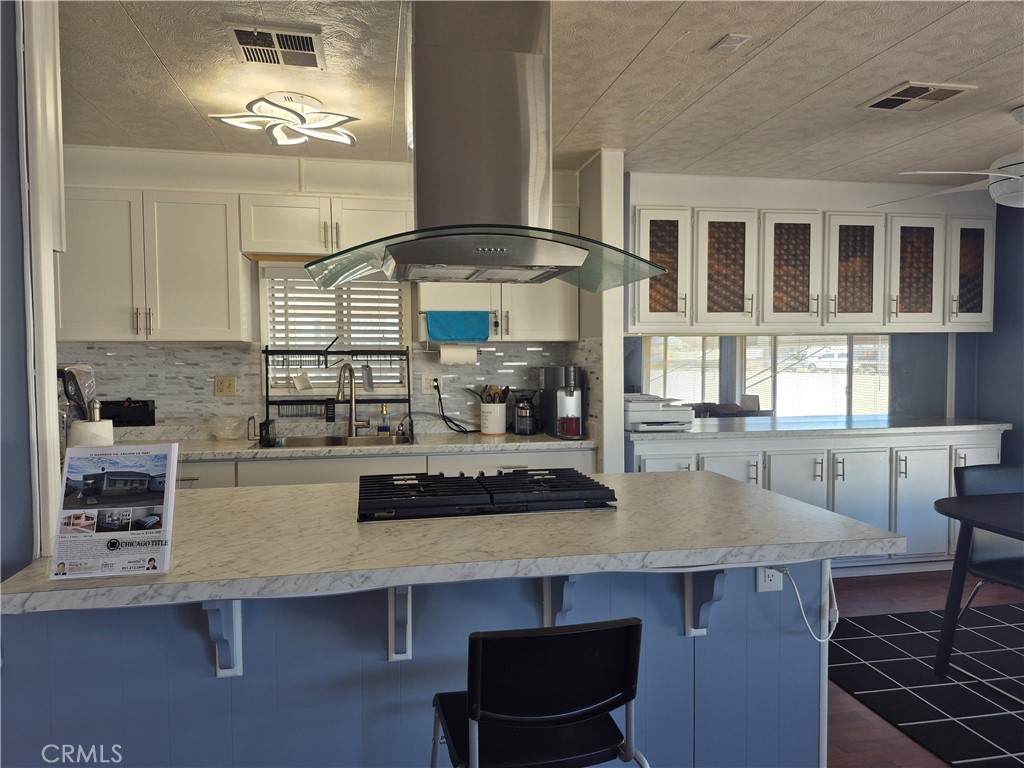22 Magnolia Via Anaheim, CA 92801 - Photo 28 of 30 a kitchen with a table and chairs in it