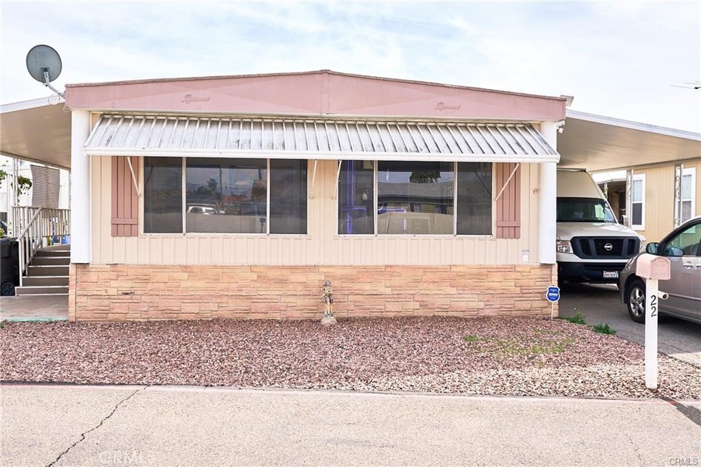 22 Magnolia Via Anaheim, CA 92801 - Photo 3 of 30 a view of a house with a barbeque grill and couches