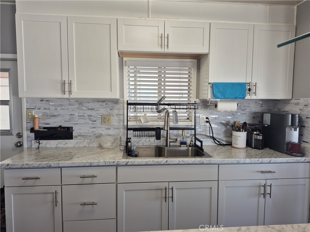 22 Magnolia Via Anaheim, CA 92801 - Photo 8 of 30 a kitchen with sink cabinets and window